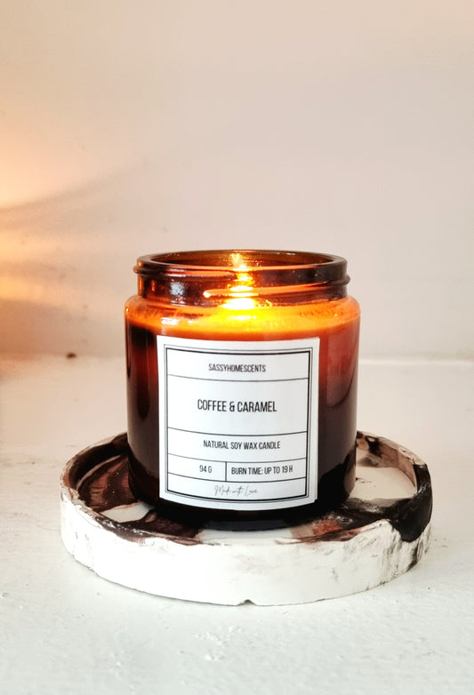 coffee and caramel scented soy candle in glass jar